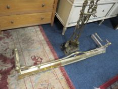 A VINTAGE BRASS FENDER WITH COMPANION SET