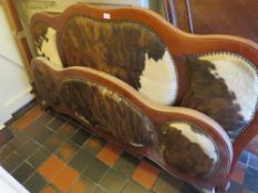 AN UNUSUAL ANIMAL HIDE DOUBLE BED FRAME WITH STRETCHERS