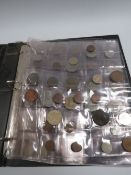 A COLLECTION OF COINS LOOSE AND IN AN ALBUM