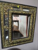 A VINTAGE CUSHION FRONTED AND GILT WALL MIRROR 67 X 58 CM