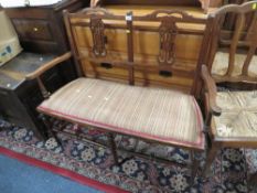 A SMALL EDWARDIAN MAHOGANY SALON SETTEE