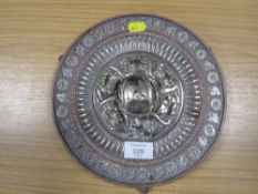 A EASTERN SILVERED PLAQUE ON THREE LEGS TOGETHER WITH A SMALL SILVER SALT