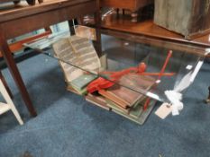 A MODERN ' MUSIC' GLASS TOPPED COFFEE TABLE