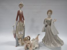 A LARGE LADRO LADY FIGURE WITH A DOG TOGETHER WITH A NAO BALLERINA
