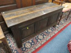 AN OAK TRIPLE PANEL COFFER W 150 CM