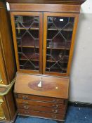 AN EDWARDIAN MAHOGANY AND INLAID BUREAU BOOKCASE