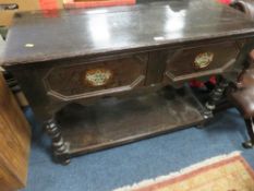 A VINTAGE OAK TWO DRAWER DRESSER W-115 CM