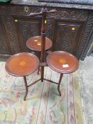 AN EDWARDIAN MAHOGANY INLAID THREE TIER JARDINAIRE STAND