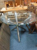 A MODERN GLASS / CHROME CIRCULAR TABLE
