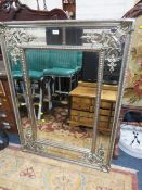 A LARGE MODERN SILVERED WALL MIRROR - 120 X 90 CM