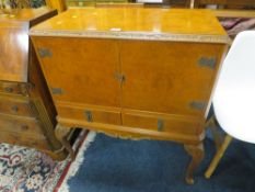 A REPRODUCTION WALNUT DRINKS CABINET ON CABRIOLE LEGS - W 85 CM