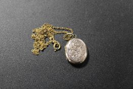 A VICTORIAN LOCKET ON CHAIN