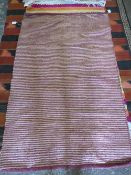 A RIBBED WOOLLEN RUG - 90 X 150 CM