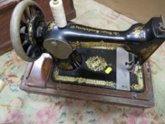 A VINTAGE CASED SINGER SEWING MACHINE SERIAL NO D982240