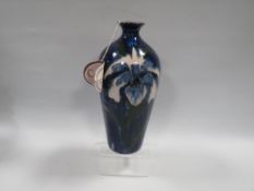 A COBRIDGE TRIAL BALUSTER VASE, decorated with blue floral pattern, impressed factory marks, H 24