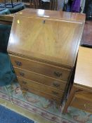 A SMALL REPRODUCTION MAHOGANY BUREAU