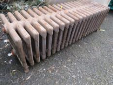 A VINTAGE CAST IRON LOW 21 FIN RADIATOR