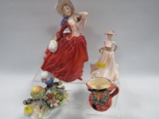 A ROYAL DOULTON FIGURINE 