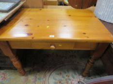 A SMALL PINE KITCHEN TABLE