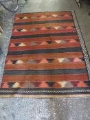 A LARGER EASTERN WOOLLEN RUG 183 X 137 CM