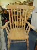 A HEAVY PINE KITCHEN ARMCHAIR