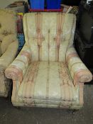 A 'HOWARD & SONS' STYLE COUNTRY HOUSE ARMCHAIR