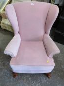 A QUEEN ANNE STYLE WINGED BACK CHAIR