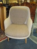 A MODERN UPHOLSTERED ARMCHAIR