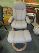 AN EKORNES STRESSLESS ARMCHAIR & STOOL