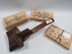A STEREO SCOPIC VIEWER WITH APPROX 50 CARDS