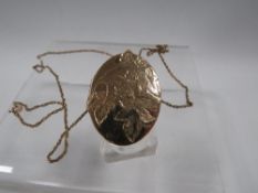 A VINTAGE LOCKET MARKED ROLLED GOLD