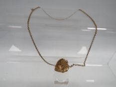 A VICTORIAN STYLE 9CT GOLD BACK AND FRONT LOCKET