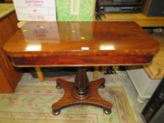 A 19TH CENTURY MAHOGANY FOLD-OVER TEA TABLE ON QUATREFOIL BASE