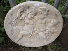 A CONCRETE GARDEN HANGING WALL PLAQUE DEPICTING CHERUBS