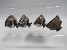 THREE ANTIQUE OTTOMAN SILVER ZARF CUPS, ALONG WITH A TOMBAK EXAMPLE (4)