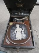 A VINTAGE WIND UP HMV GRAMOPHONE (UNCHECKED) TOGETHER WITH A ALBUM OF 78'S RECORDS