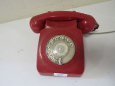 A VINTAGE RED TELEPHONE WITH MODERN CABLE A/F