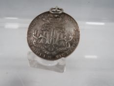 AN ANTIQUE SILVER ATA MEDAL