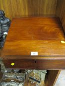 A MAHOGANY WRITING STAND WITH INTEGRATED DRAWS