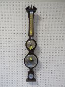 A MODERN COMBINATION BAROMETER/CLOCK THERMOMETER