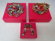 A BUTLER AND WILSON MULTI-COLOURED FLORAL THEME HINGED BANGLE, together with a Butler and Wilson