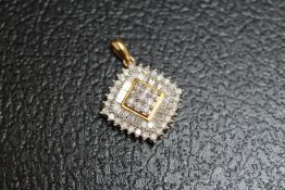A 9 CARAT GOLD DIAMOND CLUSTER PENDANT, set with brilliant and baguette cut diamonds, approx