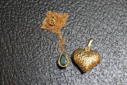 A 9 CARAT GOLD TEARDROP EMERALD PENDANT ON CHAIN, together with a 9 carat gold heart pendant, approx