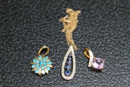 THREE 9 CARAT GOLD PENDANTS TO INCLUDE AN AMETHYST EXAMPLE. approx combined weight 5.6g