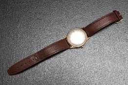 A 9 CARAT GOLD GARRARD WRIST AUTOMATIC DATE WRIST WATCH, Dia 3.5 cmCondition Report:presentation