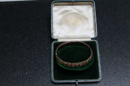 AN ANTIQUE HALLMARKED 9 CARAT GOLD BANGLE SET WITH RUBIES AND DIAMONDS - BIRMINGHAM 1917, in