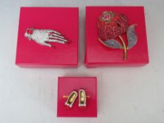 A BUTLER AND WILSON DIAMANTE HAND BROOCH, L 9 cm, together with a large red rose brooch H 9.5 cm and