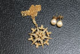 A VINTAGE SEED PEARL PENDANT, set in unmarked yellow metal on an unmarked yellow metal chain, approx