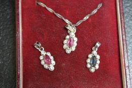 THREE ASSORTED SILVER AND WHITE METAL PENDANTS, one a chain, approx combined weight 4.6g