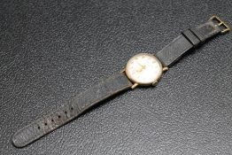 A 9 CARAT GOLD SMITHS ASTRAL WRIST WATCH, with presentation engraving to back cover, Dia 3.5 cm